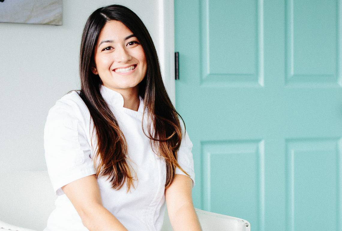 Jossie Lukacik poses in her chef's whites