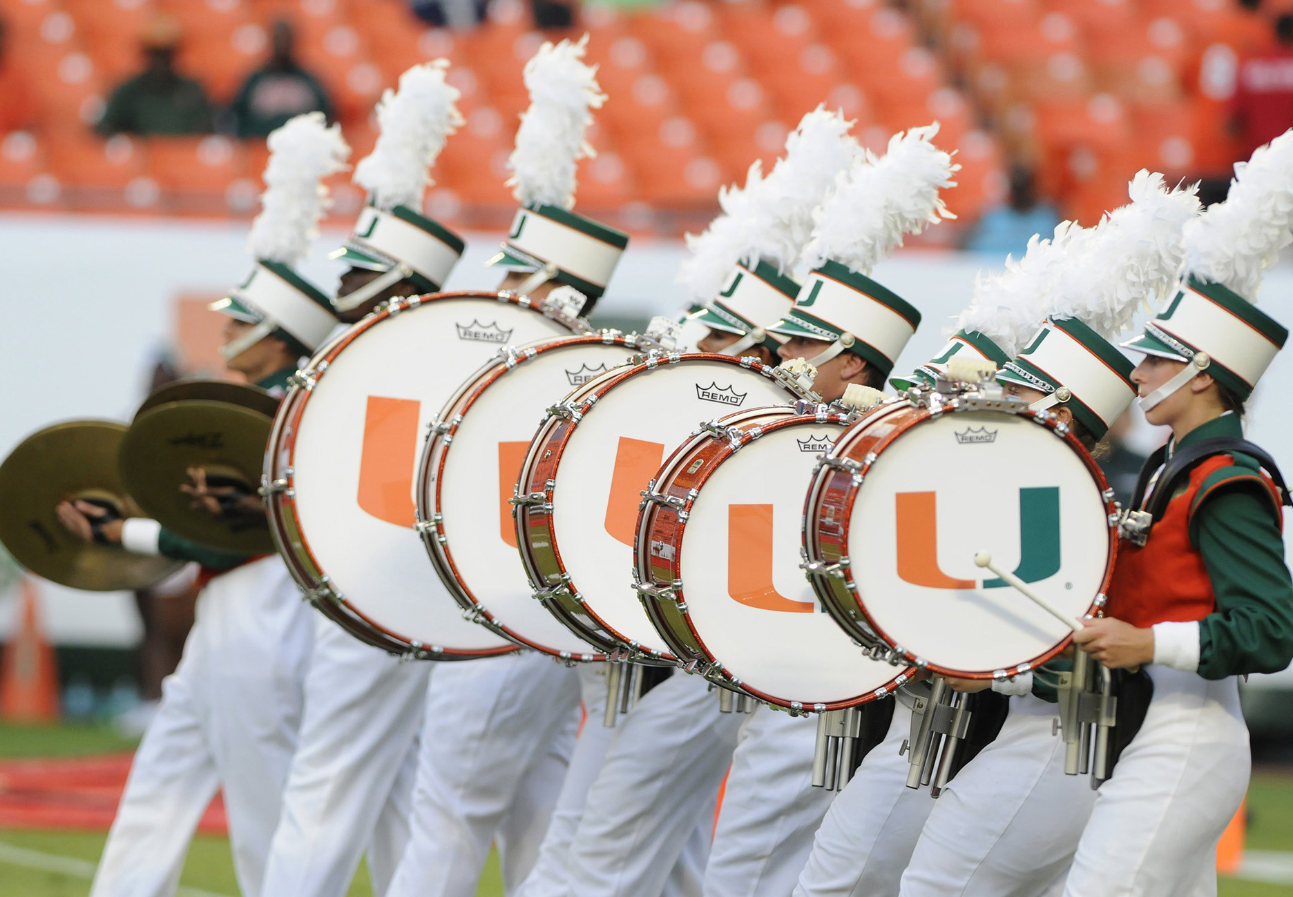 student marching band members performing at a game