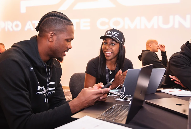 Man and woman workshopping business ideas at a PAC event