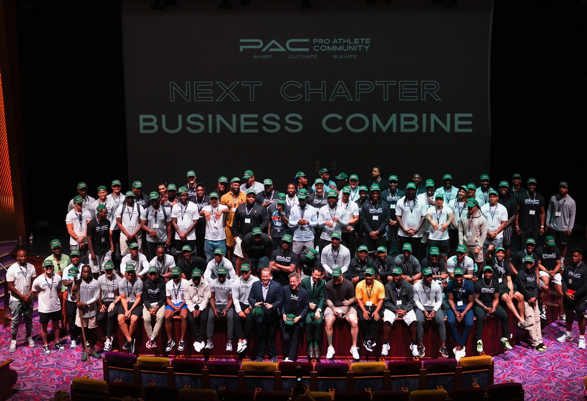 Group of athletes pose for a photo at an event