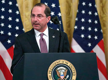 Alex Azar, Secretary, Health and Human Services speaking on top of a podium 