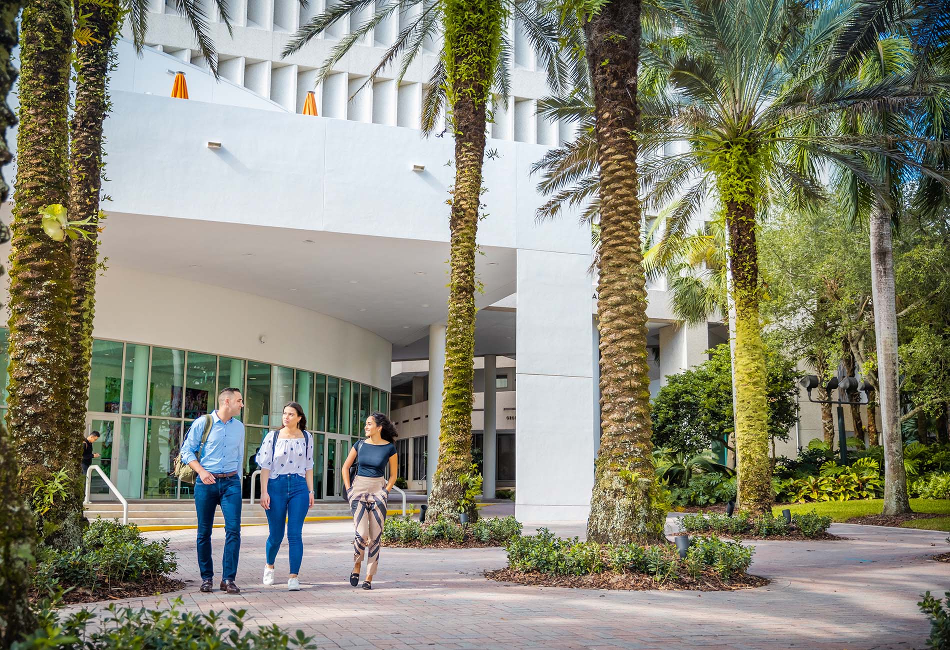 Students walking through the Miami Herbert business building.