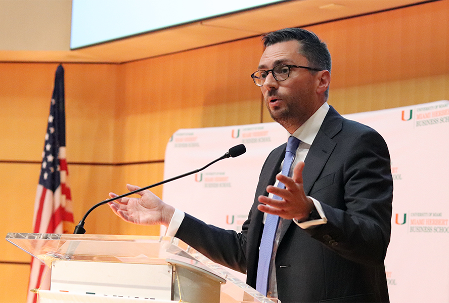 man speaking at a podium