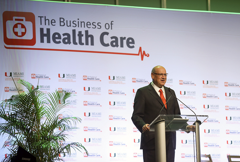 Man at podium speaking at event