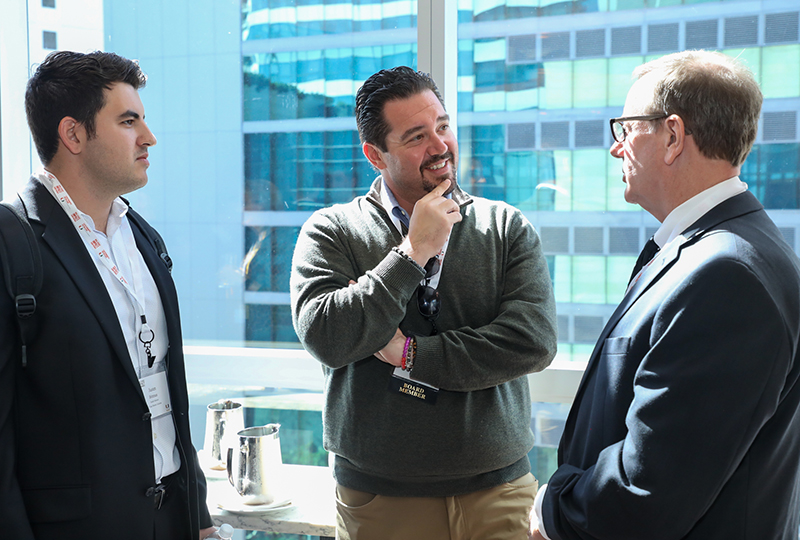 3 men talking in an office