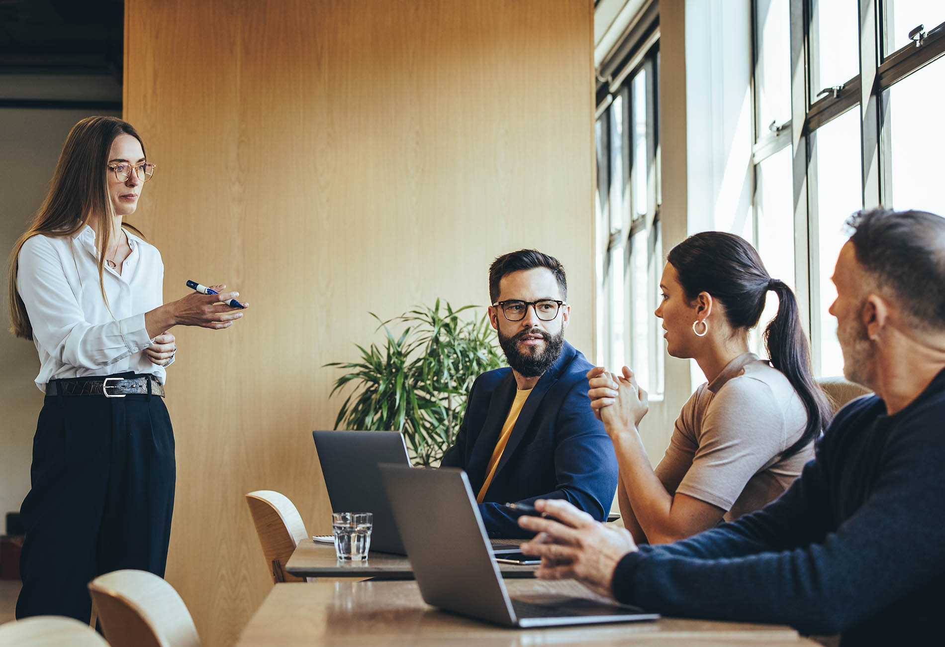 Businesswoman discussing strategy with her team