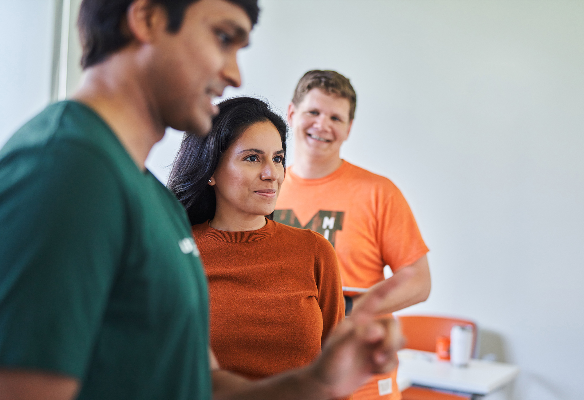 Group of students in classroom. Classroom group work. Whiteboard student interaction.