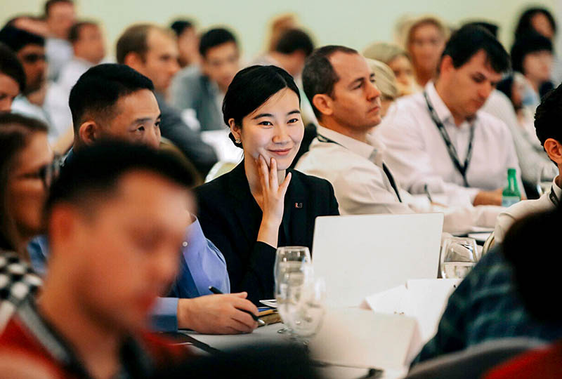 Group of students focused at an event.