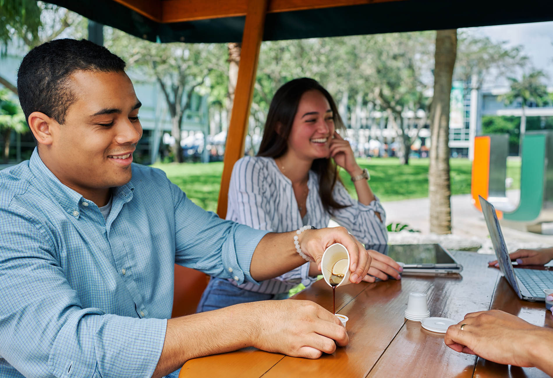 students on campus drinking coffee