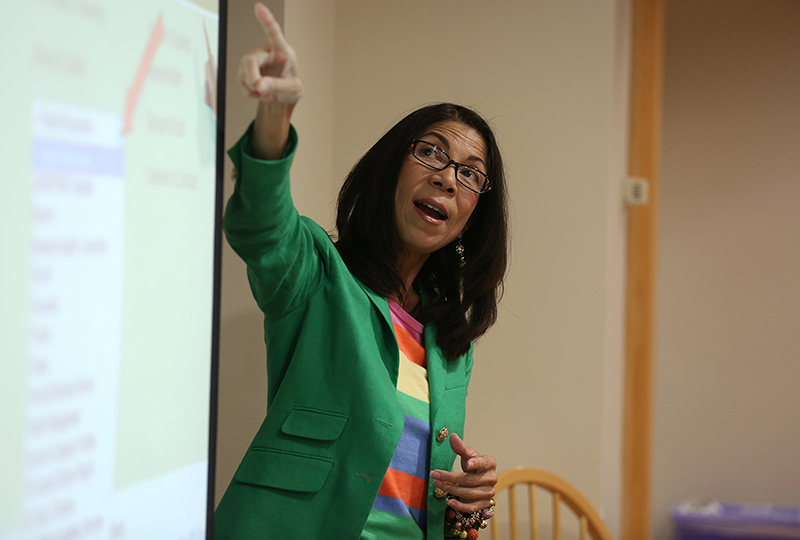 woman pointing to a projection