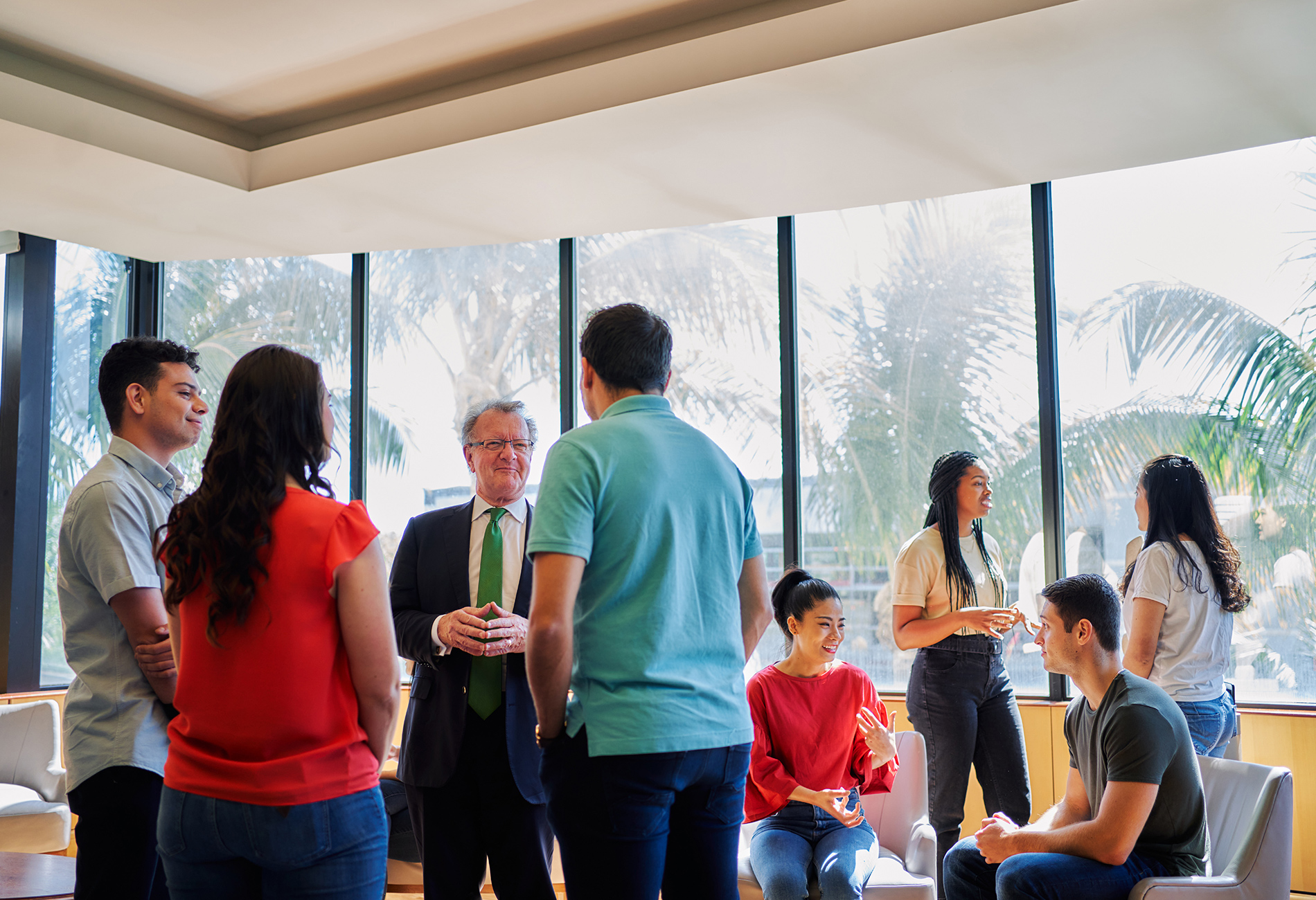 Dean Quelch meets with students at a graduate event