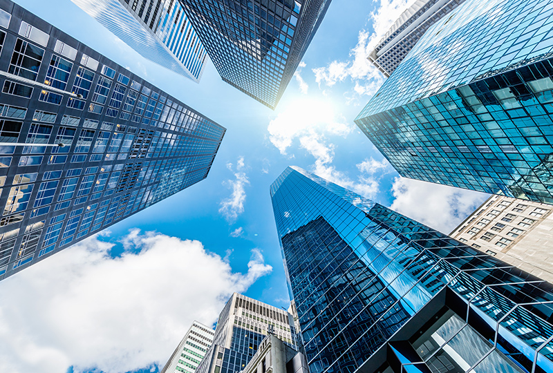 A view up to the sky surrounded by glass skyscrapers in Miami