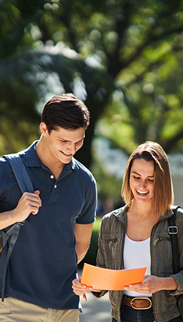 A female and a male student have a discussion outside