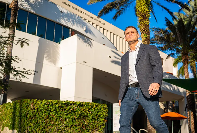 Student outside Miami Herbert building