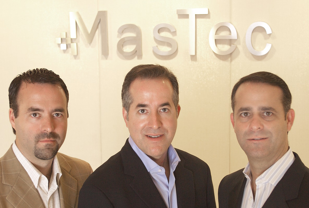 3 men in front of mastec sign