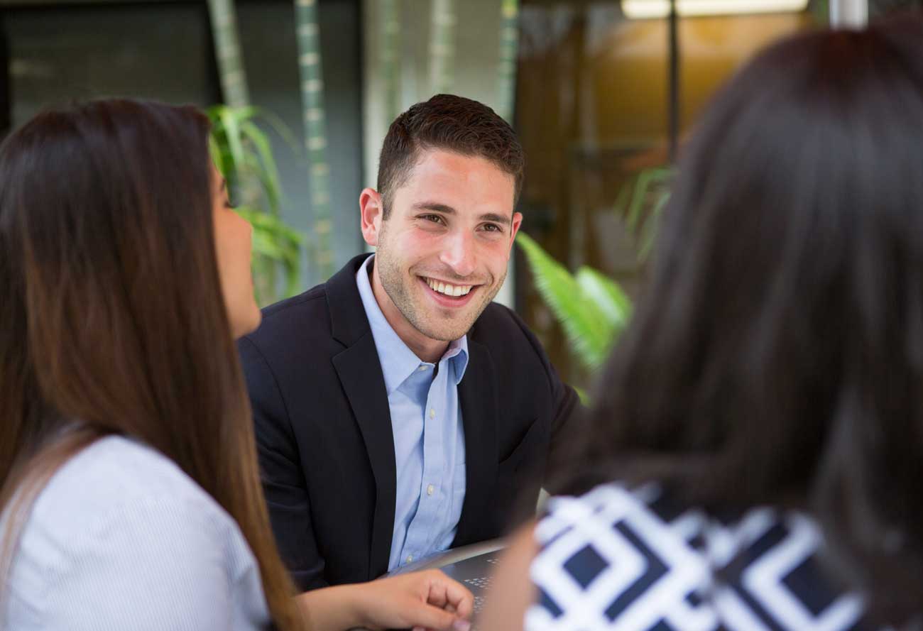 a man in a suit smiling