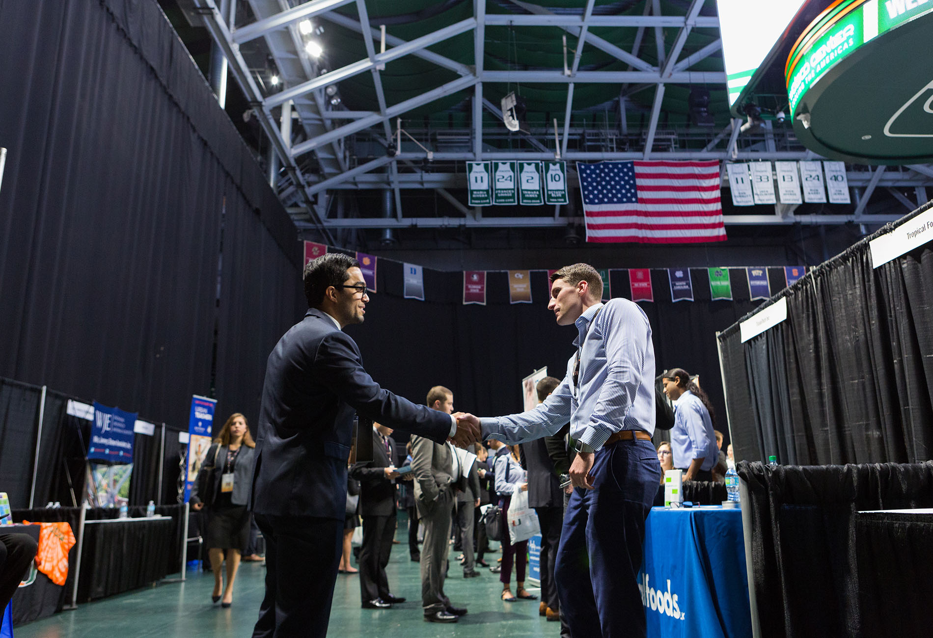 students shaking hands at career expo