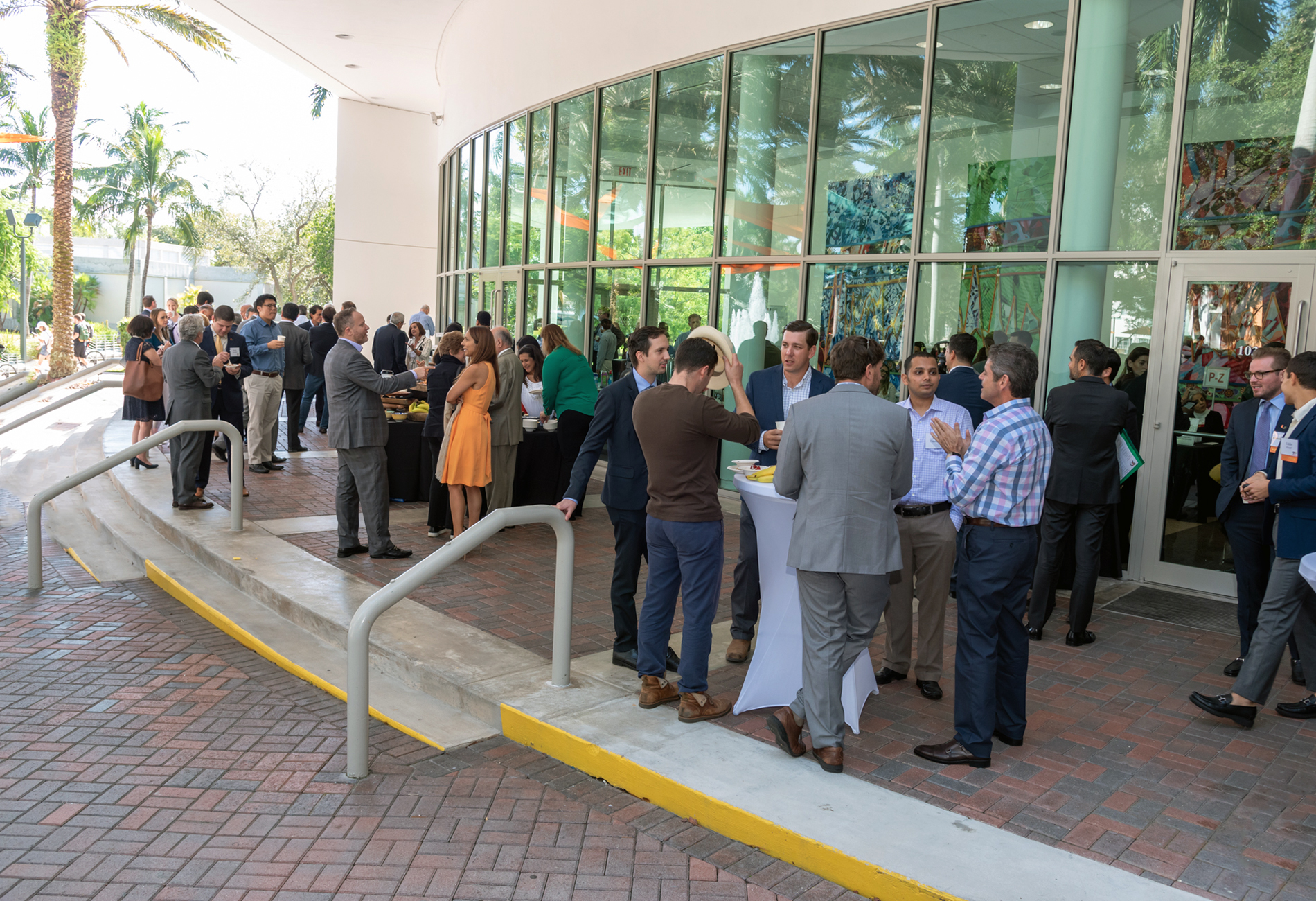 Alumni, students and professors at a Miami Herbert event hosted outside of Storer auditorium. 