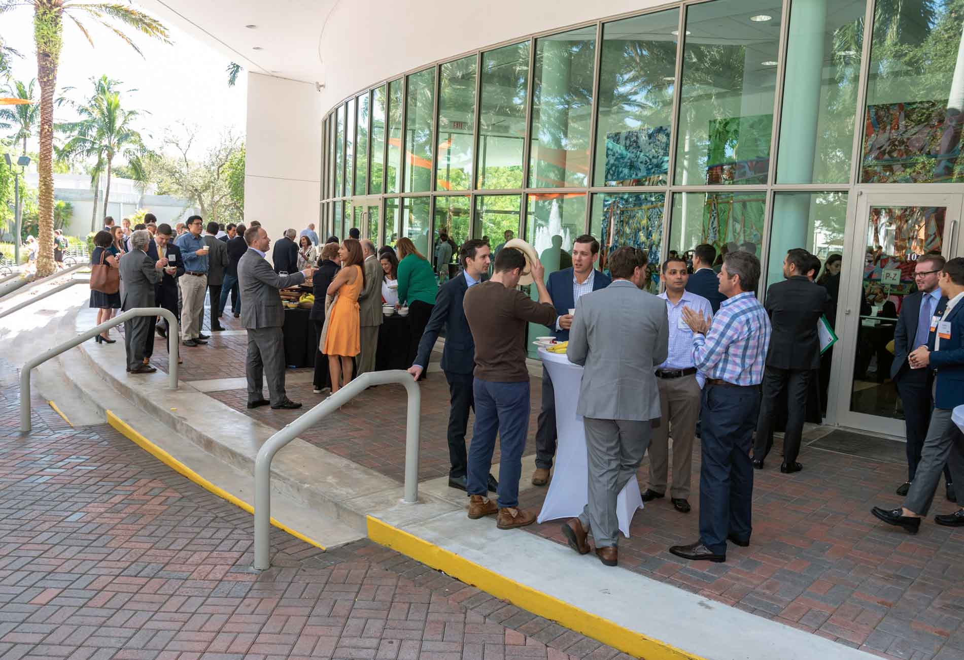Alumni, students and professors at a Miami Herbert event hosted outside of Storer auditorium.