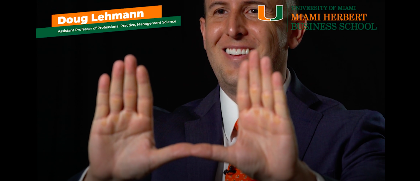 Doug Lehmann holds his hands up in a "U" shape.