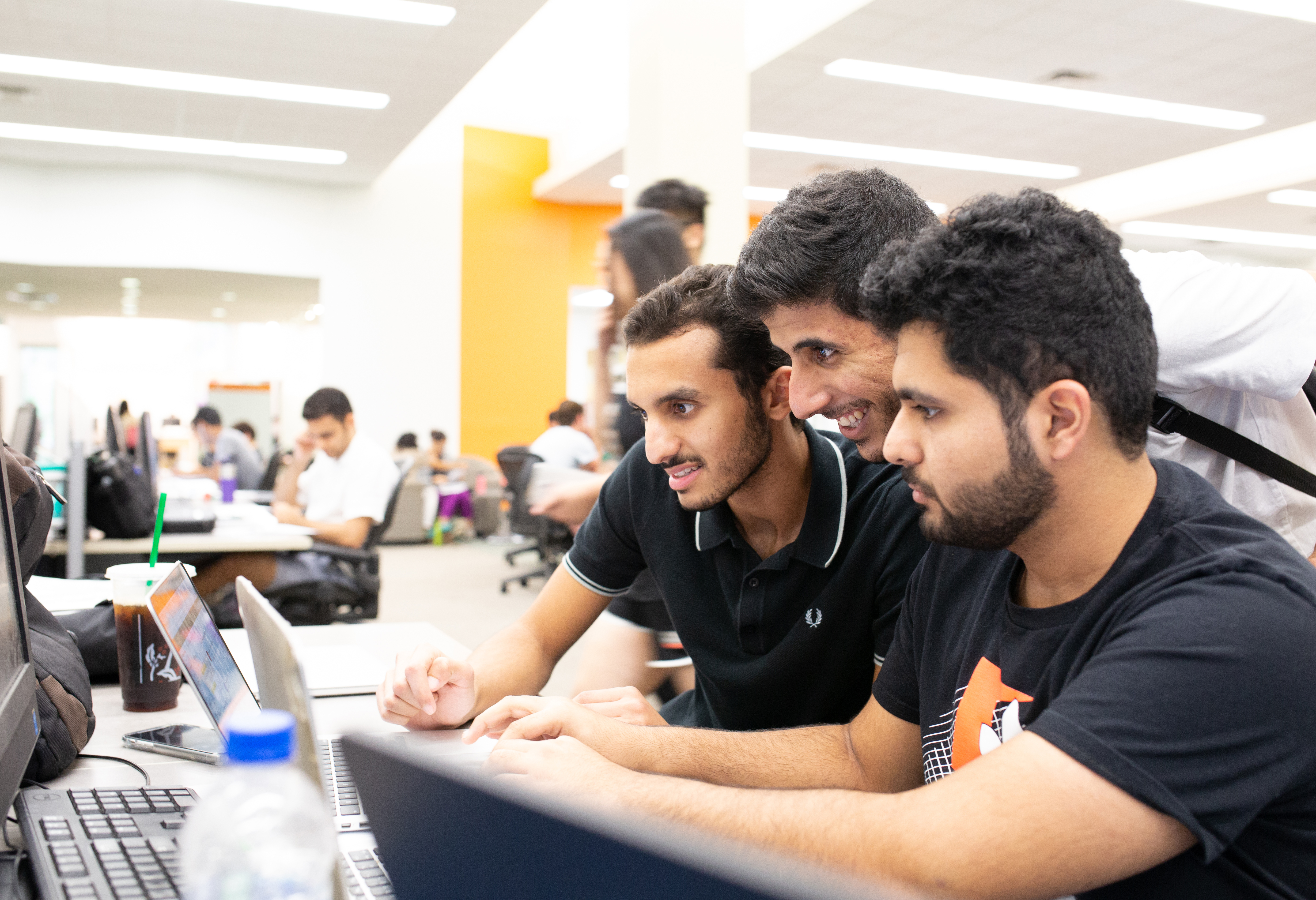 Students working on an assignment in the library.