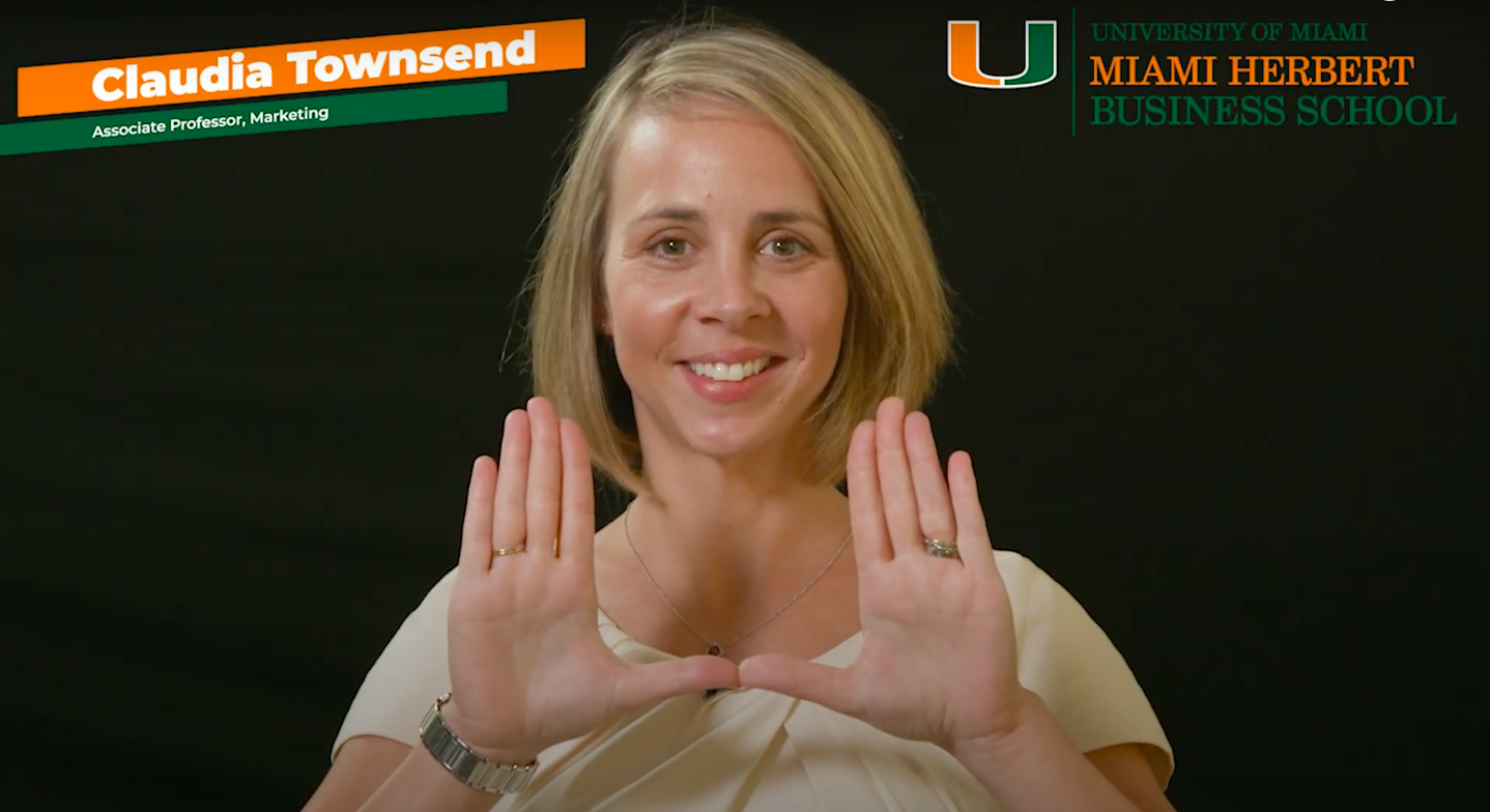 Claudia Townsend holds her hands up in a"U" shape.