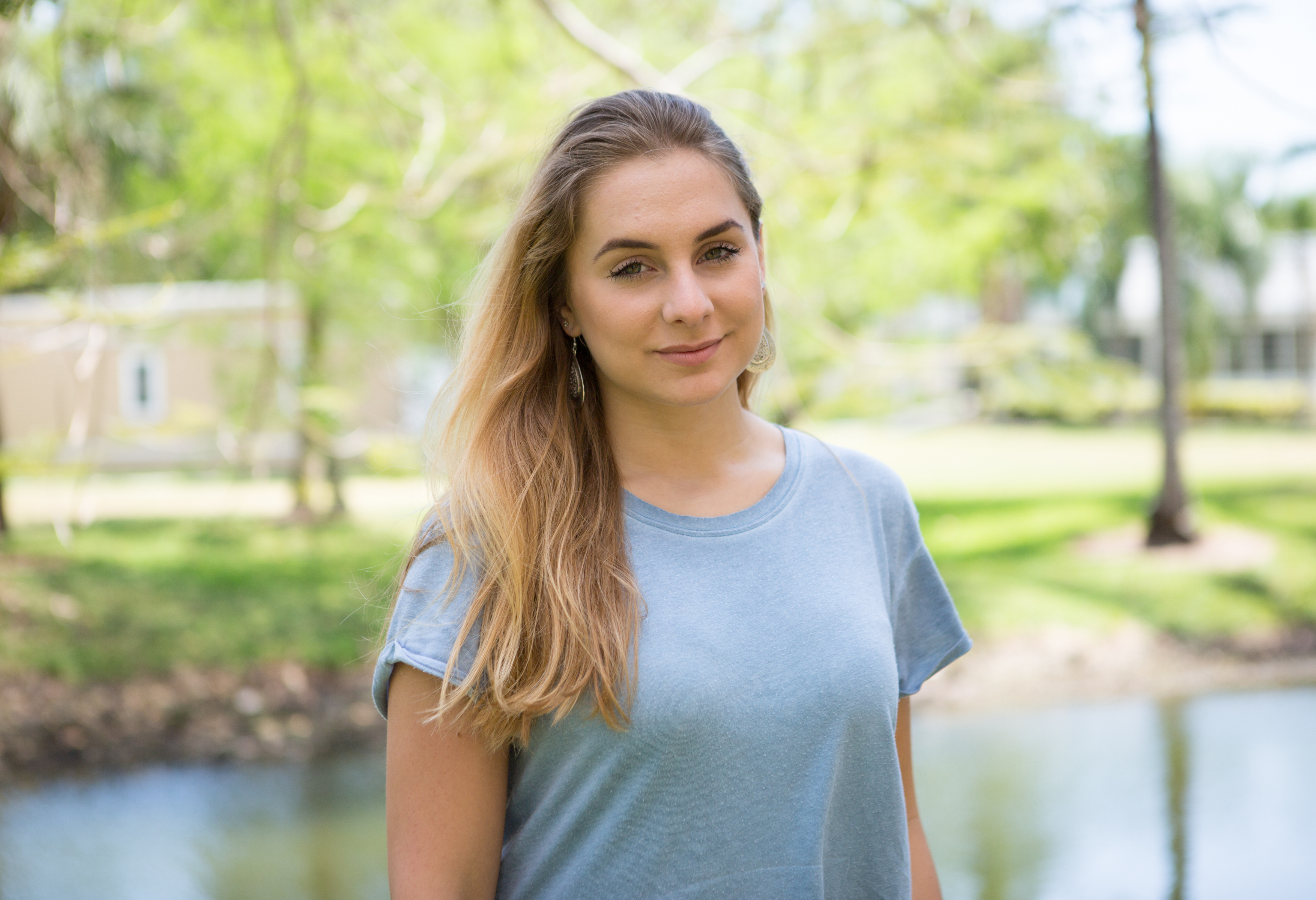 Close up of a student standing outdoors.