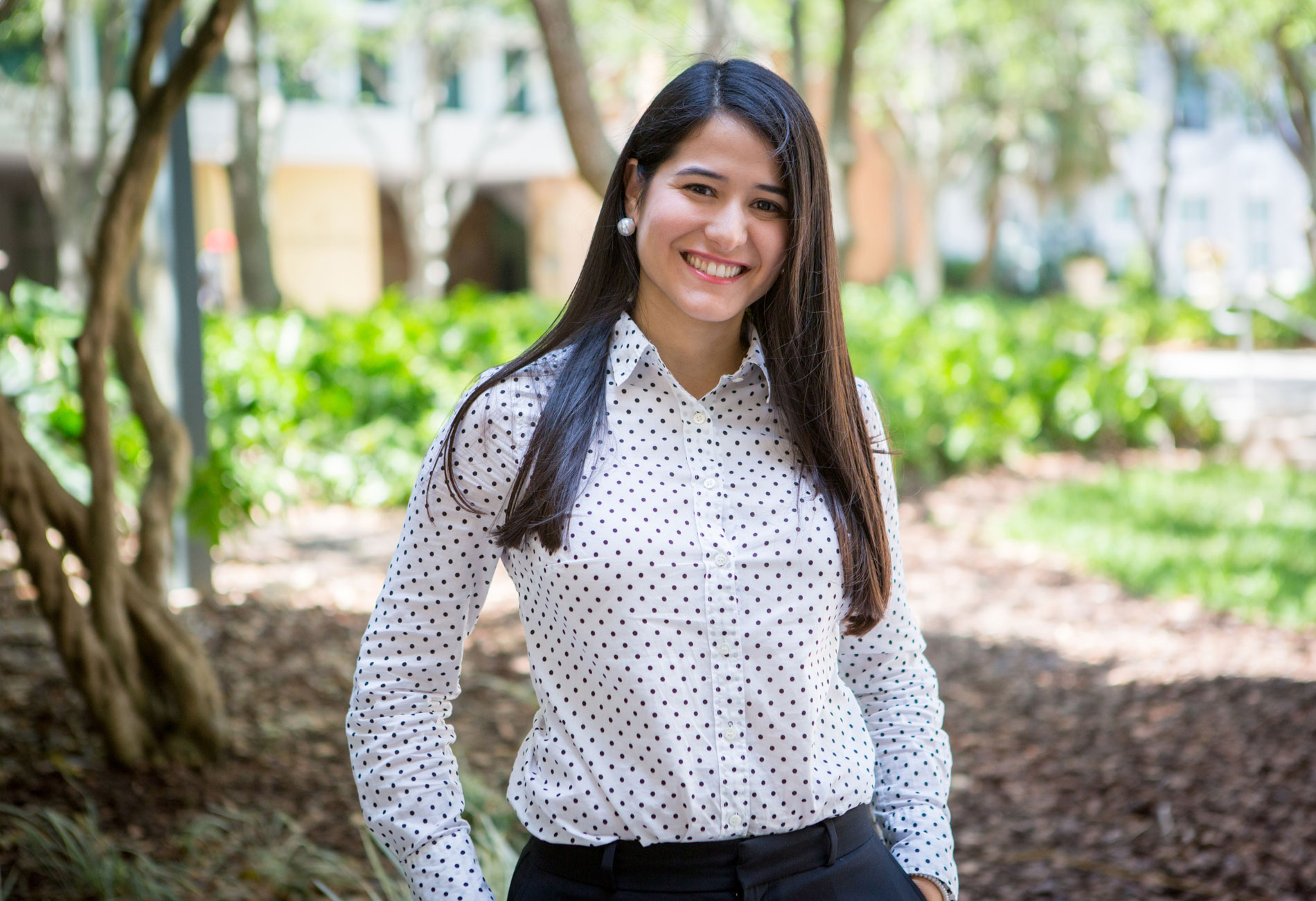 Female student standing outdoors.