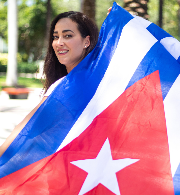 young woman holds Cuban flag